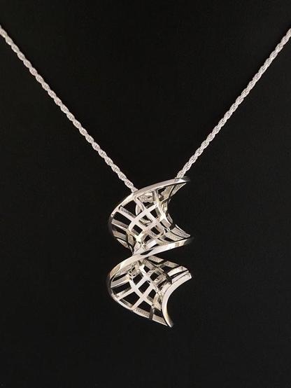 Photograph of Vivace, a polished sterling silver pendant, about 35mm tall, in the shape of a climbing spiral mesh, fitted with a silver rope chain and sits on a black background.