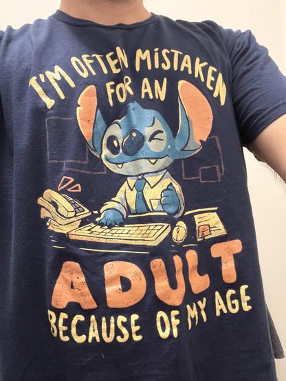 Blue t-shirt with Stitch saying « I’m often mistaken for an adult because of my age »