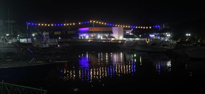 Double the glow! Independence lights shimmer across the bridge and in the Careenage below.