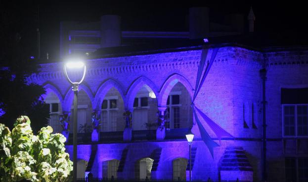 Ribbons and lights drape Parliament's historic coral stone arches in our national colours!