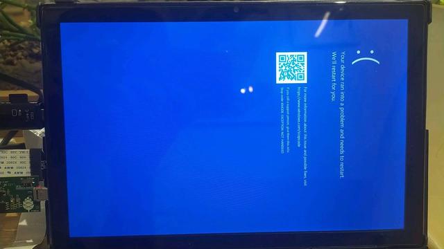 Windows 10 Blue Screen of Death on a PineTab 2 tablet computer.

On the left side of the device, there are some debugging equipment attached. These are:
- MicroSD -> Fullsize SD card adapter cable
- PineTab UART adapter
- A USB stick containing a copy of Windows PE

Error code: KMODE_EXCEPTION_NOT_HANDLED