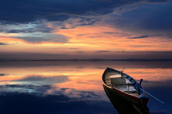 photo of wooden boat on sea