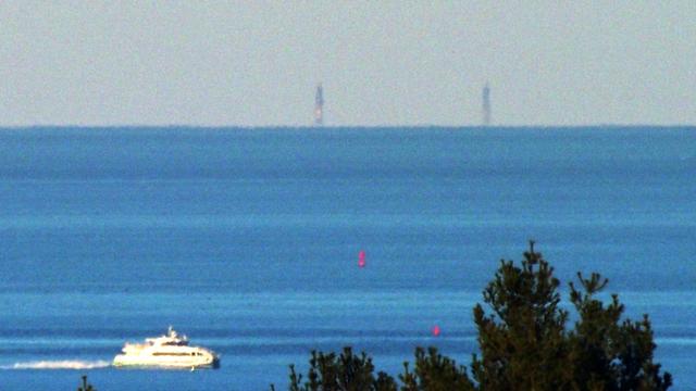 The twin lighthouses on Thacher Island, Rockport MA, photographed from Buck Hill.