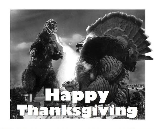 photo of Godzilla confronting a giant turkey with the title "Happy Thanksgiving"