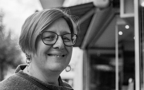 Black and white photo of a smiling woman