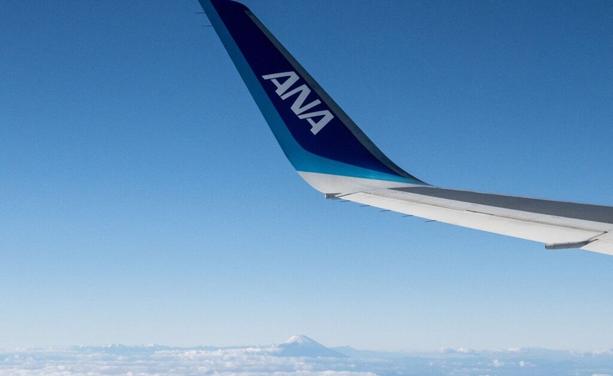 Japan&#039;s highest peak at 3,776 meters (12,388 feet), seen past the winglet of an All Nippon Airways (ANA) aircraft bearing the company logo, as seen during a flight above Shizuoka Prefecture