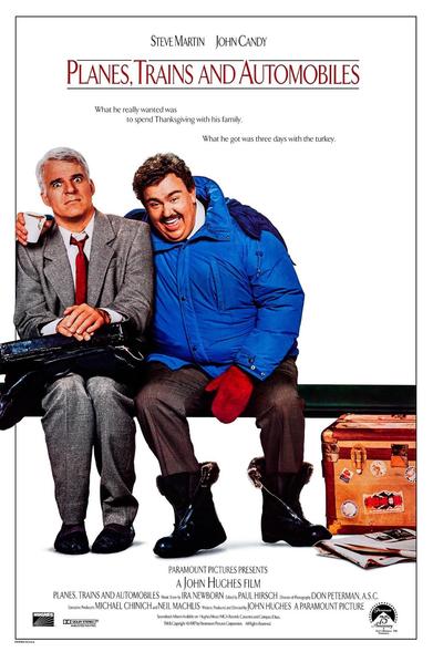 Movie poster for "Planes, Trains and Automobiles" featuring Steve Martin and John Candy. One is dressed in a gray suit and has a worried expression, while the other, in a blue winter coat and red mittens, is smiling and supportive. They sit on a bench with a white background.