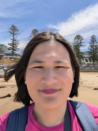 Liz selfie in front of the North Beach bathhouse and pristine beach.