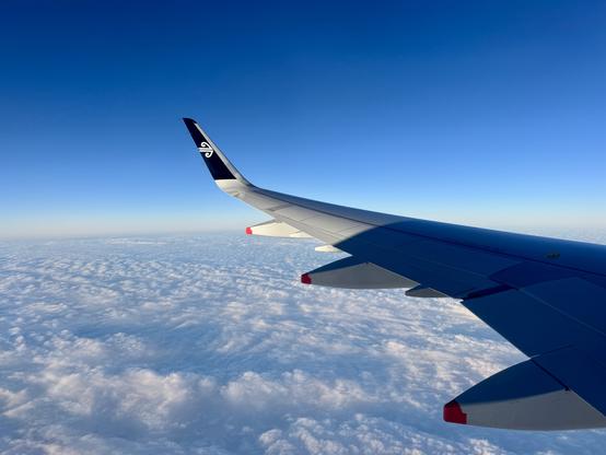 View out Air New Zealand aircraft window showing cloud over the Tasman Sea