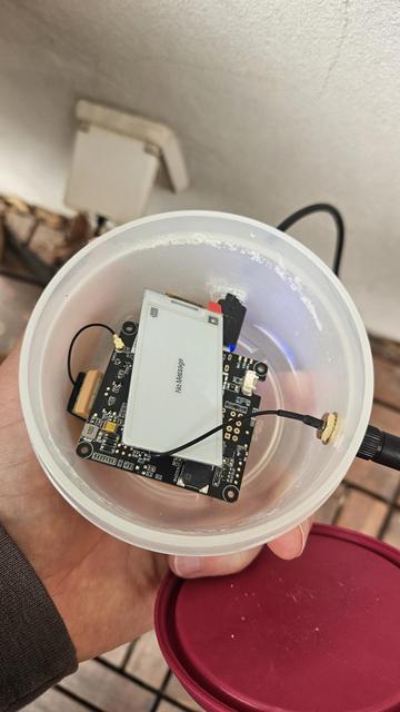 A tupperware container with a meshtastic node inside.
