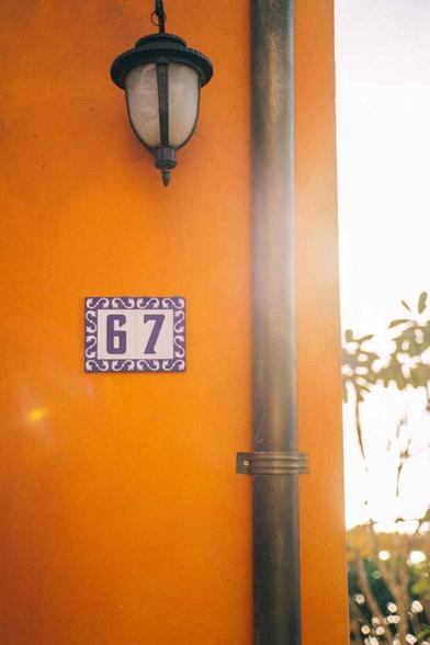 waal lamp beside a house number