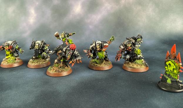 Miniatures of green and black Orc football players.
