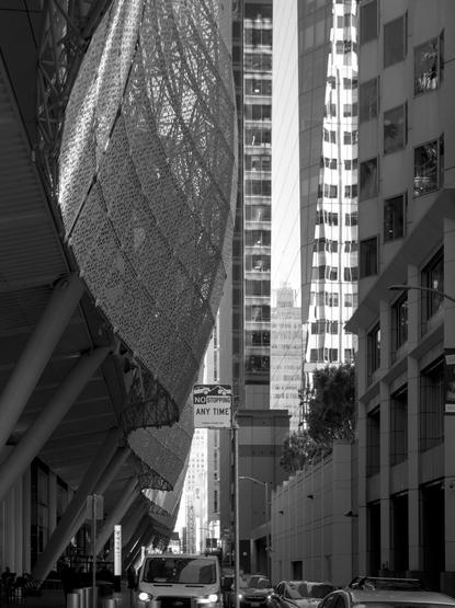 The curvy structure of the Salesforce Transit Center, with more high-rise buildings in the background