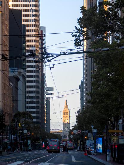 As in the description. The street was in shade but the Ferry Building in the distance is lit up in the golden sun.