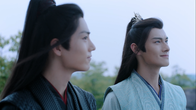 Wei Wuxian and Jiang Cheng stand side by side on a cliff near Lotus Pier, both smiling and enjoying a moment of camaraderie.