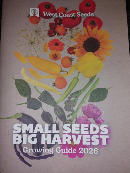 The cover of the 2026 catalogue from West Coast Seeds, showing a rainbow-hued image of tomatoes,  flowers, peppers, eggplant, herbs, and cauliflower. The cover reads "Small Seeds, Big Harvest. Growing Guide 2026".
