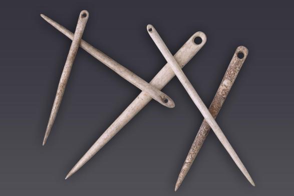The picture shows six needles of different sizes. They were made of bone resemble their modern descendants with an eye at one end and a tapered end.
