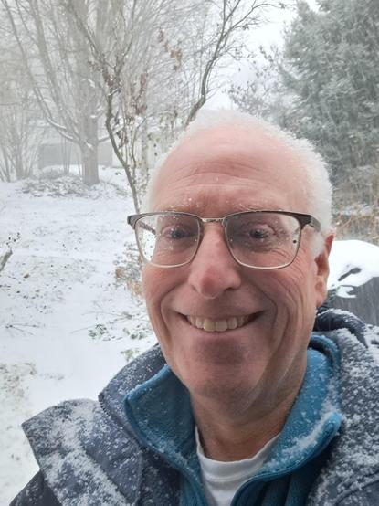 Also me, smiley, snow covered, with my snowy back yard behind me.