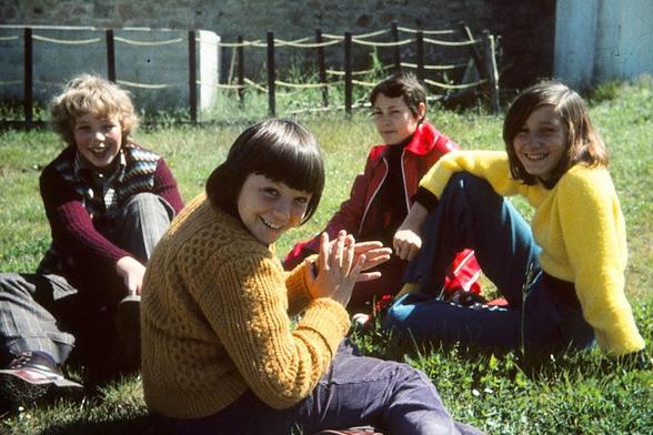 a colour 35mm slide featuring children sat on the grass