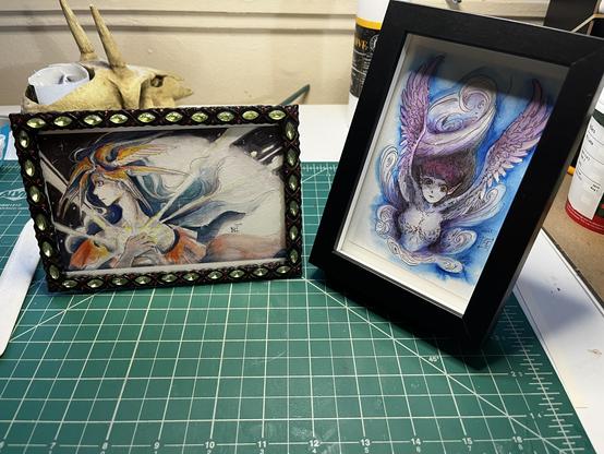 Two framed watercolor paintings.
