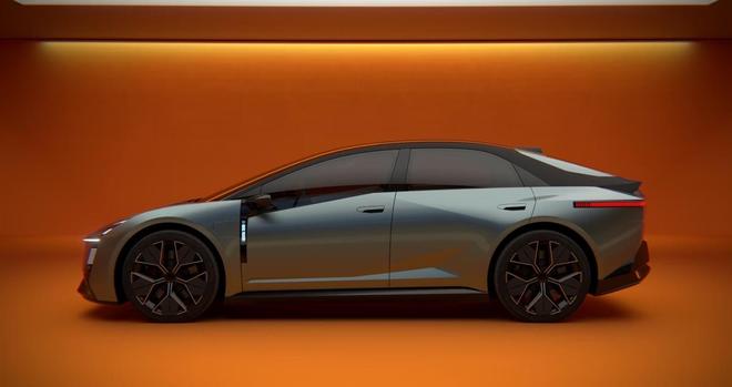 A sleek, modern electric car is shown from the side, set against an orange background. The vehicle features a streamlined design and stylish alloy wheels.