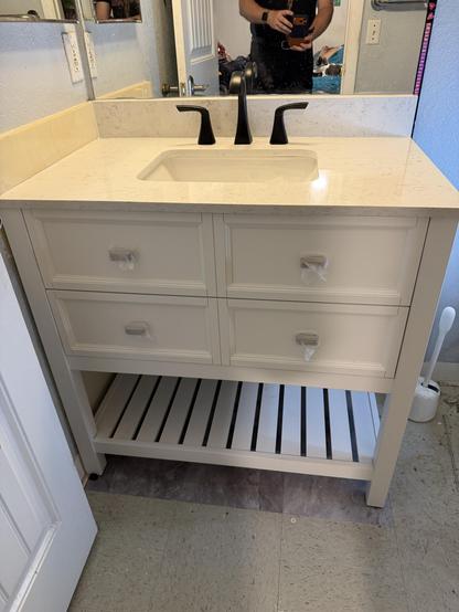 Another white sink 
new vinyl tiles underneath
They don't match the rest