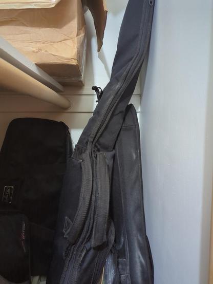 Gigbag leaning against a wall at an angle