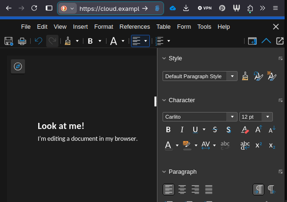 Screenshot of a browser window. Under the URL bar, the UI of an Office suite is visible (menu bar, toolbar at the top, right sidebar, both with formatting options). The text in the document reads “Hey Look at me! I’m editing a document in my browser.”