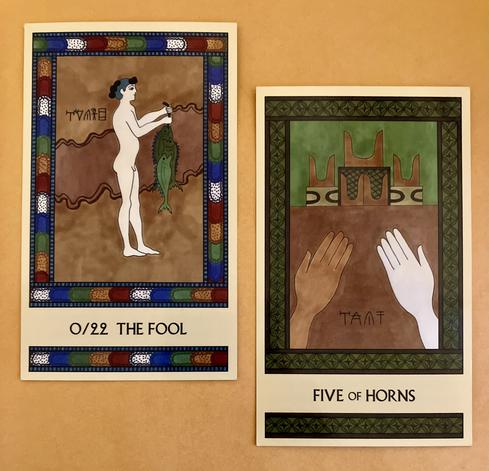 Two Minoan Tarot cards side by side on a golden background. The Fool, on the left, has a jewel-toned multicolor border. It depicts a naked Minoan boy, standing in front of a tan background, facing right, holding a large string of fish in front of him. The Five of Horns, on the right, is painted in shades of deep green and brown. It shows two hands reaching out toward a large shrine that holds five pairs of sacred horns.