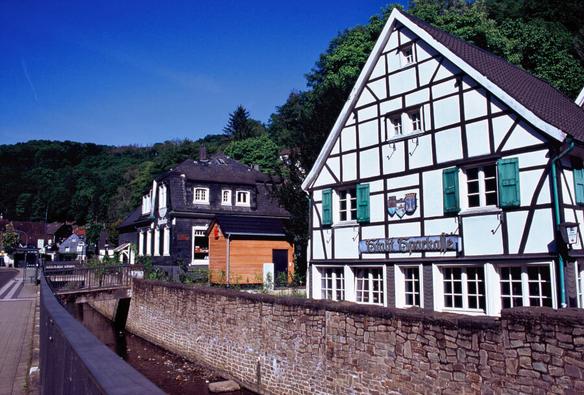 Half timbered shops and houses along a canal