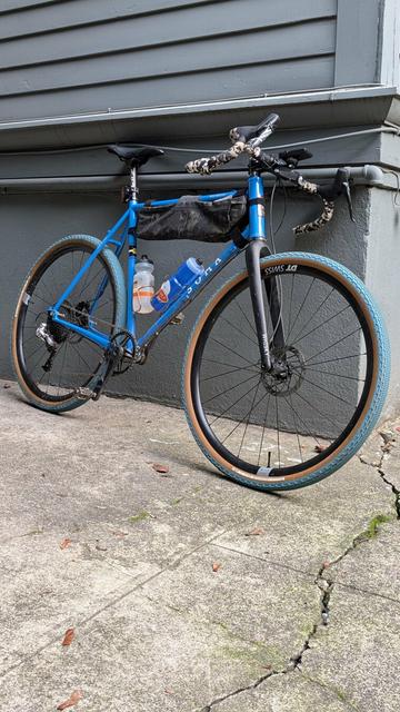 A bicycle leaning against a building
