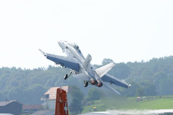 plane jet full power thrust taking off at strong angle