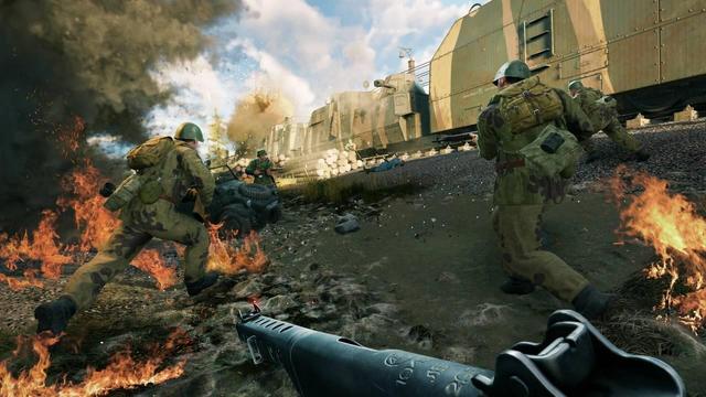 🕶️ An FPS view of an American (WW2) squad near a cannon-equipped armored rail convoy, as they escape from a burning area and come face to face with an Axis opponent - also armed, near his military vehicle, ready to fire.

📚️ Enlisted is a free (freemium) WW2-themed squad-based FPS / MMO in which the player is an infantry platoon leader, tank crewman or airplane pilot, with the other members being AIs who obey him. Dozens of units with different specializations participate simultaneously in battles, offering spectacular density and immersion in battle while maintaining a high contribution from each participant to the team's victory. Infantry, armored vehicles and aircraft fight together, and players can try out several roles in a single game session. The weaponry, soldier uniforms, appearance and capabilities of in-game vehicles are all historically accurate.
