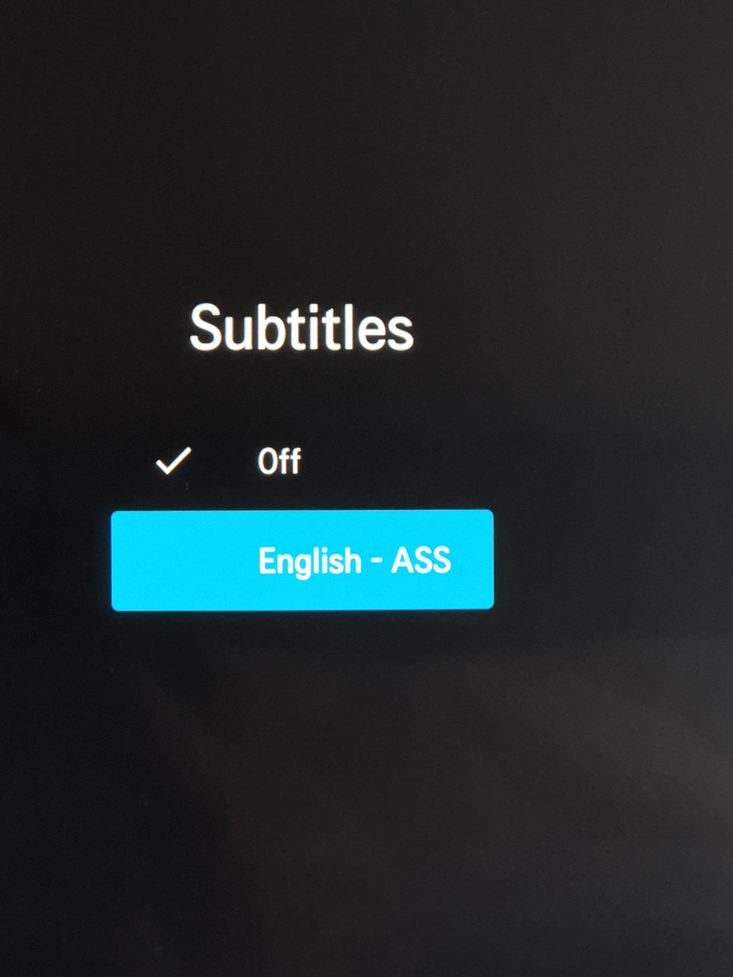 A photo of a screen where there are two options for subtitles - "off"... and "ass"