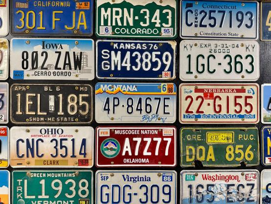 15 different US state license plates. In the lower middle is the Muscogee Nation license plate.