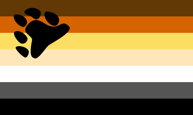 The LGBTQIA+ bear pride flag featuring horizontal stripes in dark brown, orange, golden yellow, beige, white, gray, and black, with a black bear paw print in the upper left corner.