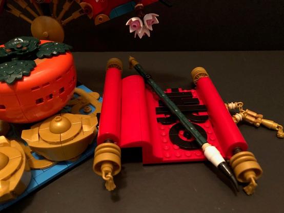 LEGO 80117 Good Fortune - close up of scroll and brush