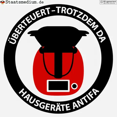 Ein Satirisches Bild: Ein rundes Emblem mit dem Text „ÜBERTEUERT - TROTZDEM DA“ und „HAUSHALTSGERÄTE ANTIFA“, in der Mitte ein stilisiertes rotes Gerät mit schwarzen Details.