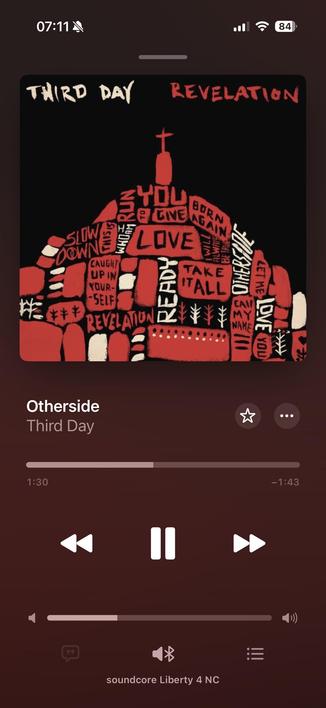 The image displays a music player interface featuring the song "Otherside" by Third Day. The album title "Revelation" and the band's name are prominently displayed. The background artwork is characterized by bold text and a striking color scheme.