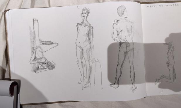 Drawing portraits of a naked male art model