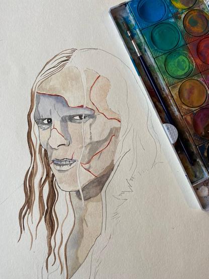 A painting work in progress: Jacob Elordi as the Creature from "Frankenstein", looking angry or annoyed at the viewer. Next to the image is a paintbox with watercolours and a brush.