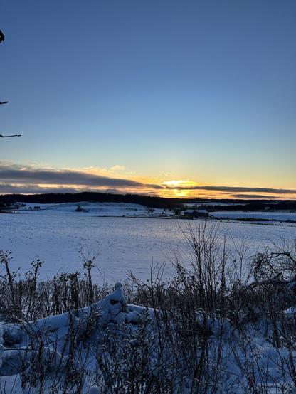 My glasses are too fogged up for me to see what I’m writing so I’m using the voice recorder. The sun is just up. You can see it behind the hills behind the barn. The fields are snowy the sky is mostly blue and the air is crisp and fresh and still.