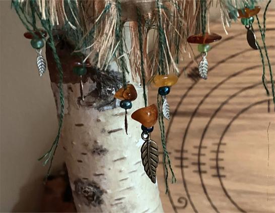 closeup of the beads and leaf charms.