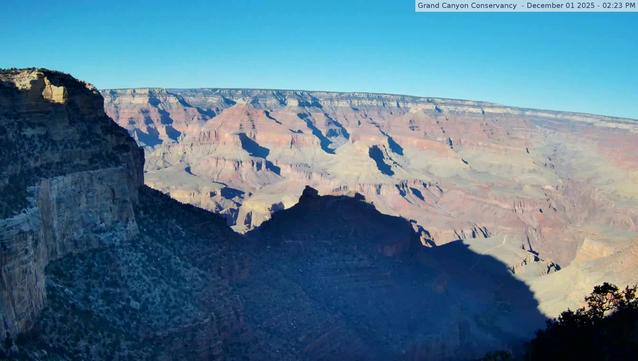 In this north-facing view, the Battleship formation is in the center, and Havasupai Gardens (formerly known as Indian Garden) is visible - lower right, 3000 feet (915 m) below. Kolb Studio was the family home and photography studio of the Kolb Brothers, pioneer photographers at Grand Canyon. Verify that the time and date of the picture is current (upper right in the photo) Camera is hosted by Grand Canyon Conservancy. The image updates every minute.
