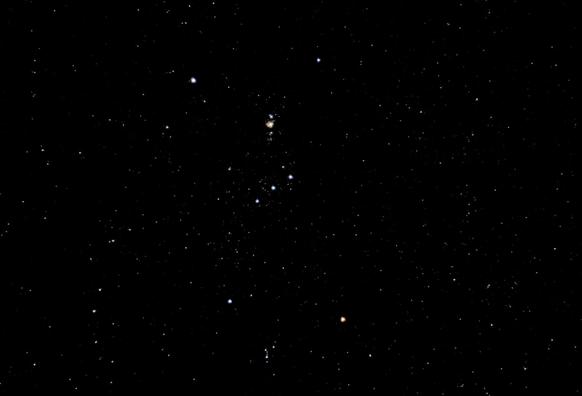 The constellation of Orion, but upside-down as it has been shot from the Southern Hemisphere. Orion's Belt is in the centre of the frame .