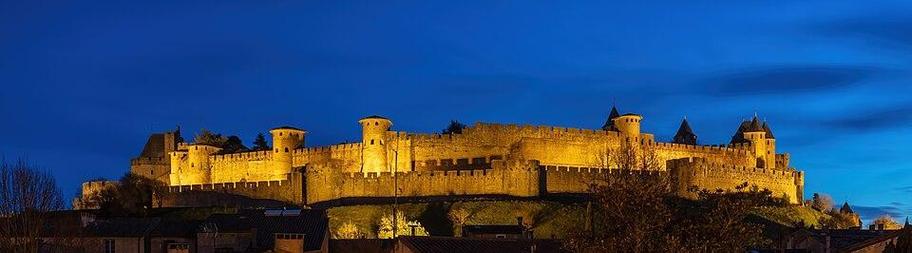 Fortified city of Carcassonne during the blue hour, France. Founded during the Gallo-Roman period, the citadel derives its reputation from its 3 kilometres (1.9&nbsp;mi) long double surrounding walls interspersed by 52 towers. The medieval citadel, situated on a hill on the right bank of the river Aude, was restored at the end of the 19th century by the theorist and architect Eugène Viollet-le-Duc. In 1997, it was added to the UNESCO list of World Heritage Sites because of its exceptional testimony to the architecture and planning of a medieval fortress town.