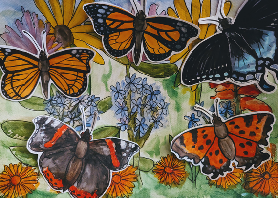 Watercolor of five butterflies, cut out and placed on top of a background with a colorful mix of wildflowers.
