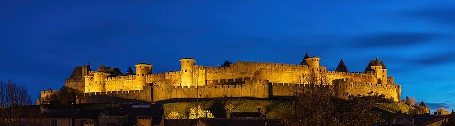 Fortified city of Carcassonne during the blue hour, France. Founded during the Gallo-Roman period, the citadel derives its reputation from its 3 kilometres (1.9&nbsp;mi) long double surrounding walls interspersed by 52 towers. The medieval citadel, situated on a hill on the right bank of the river Aude, was restored at the end of the 19th centur ...