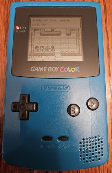 Photo of a game boy colornwith dragon warrior monsters. Text reads: "huh you made 215 of"