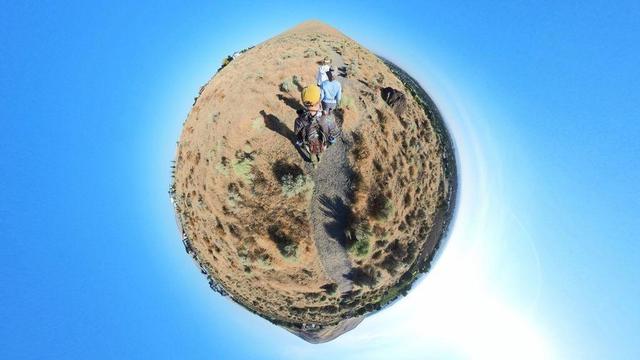 A desert mountain hiking trail scene from the Tri-Cities area of eastern Washington State under clear blue skies.
